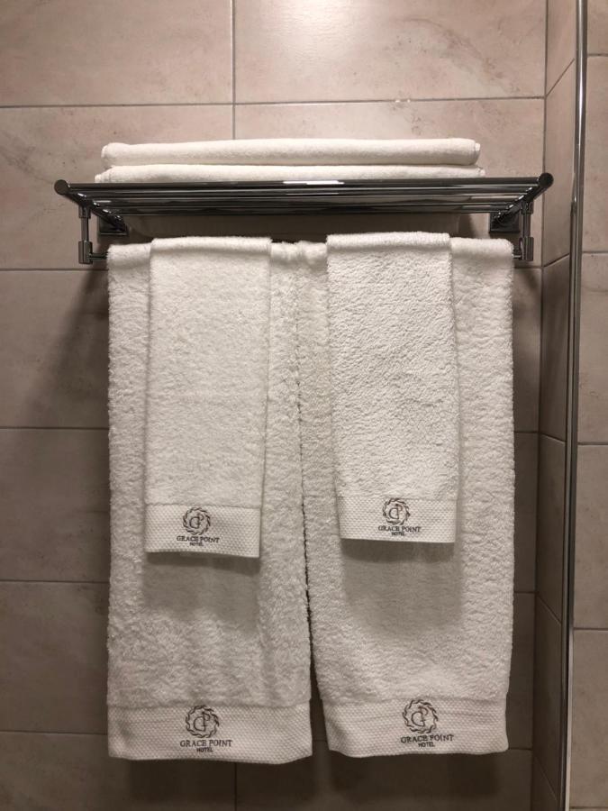 Grace Point Hotel Astana Quarto foto