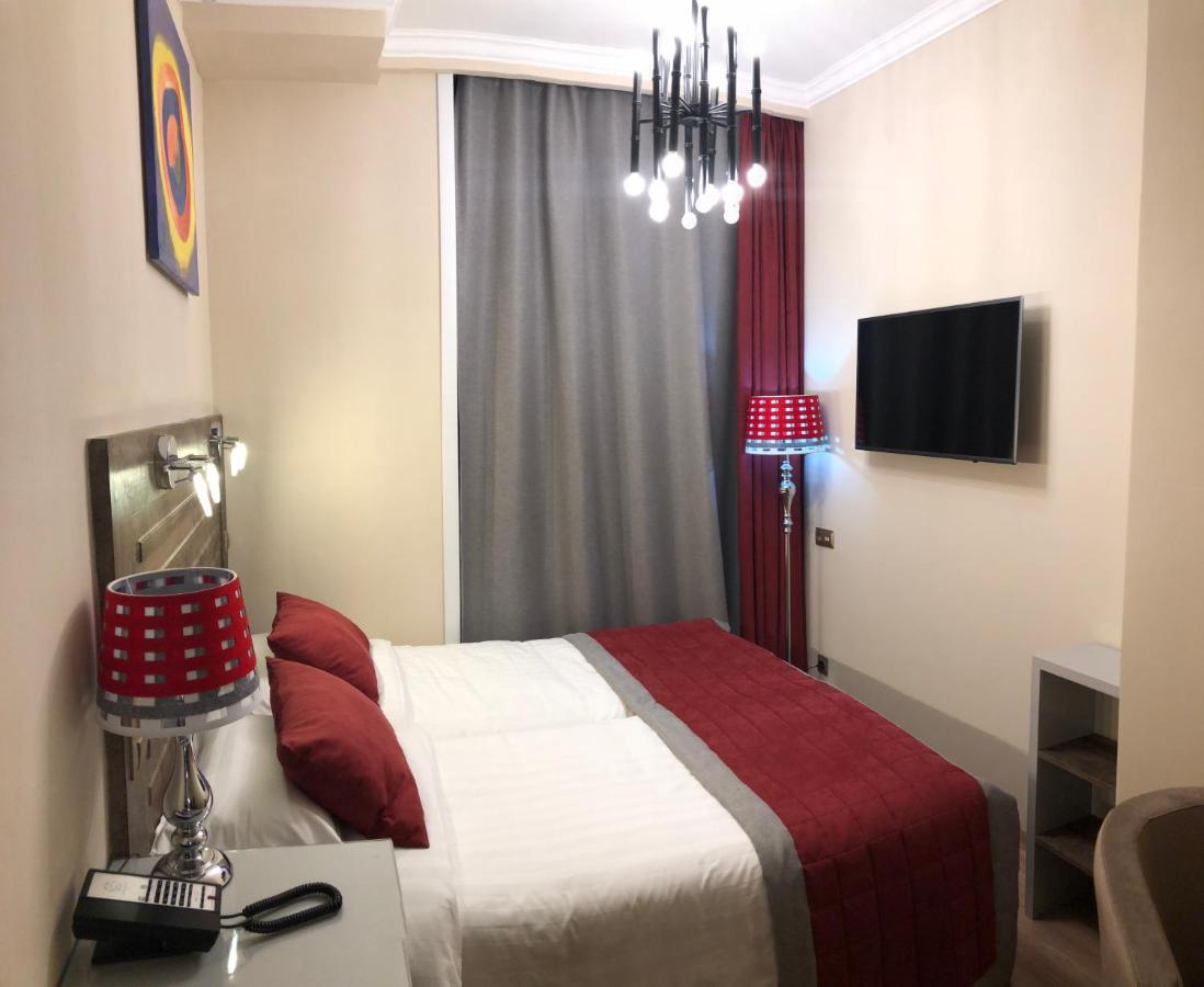 Grace Point Hotel Astana Quarto foto