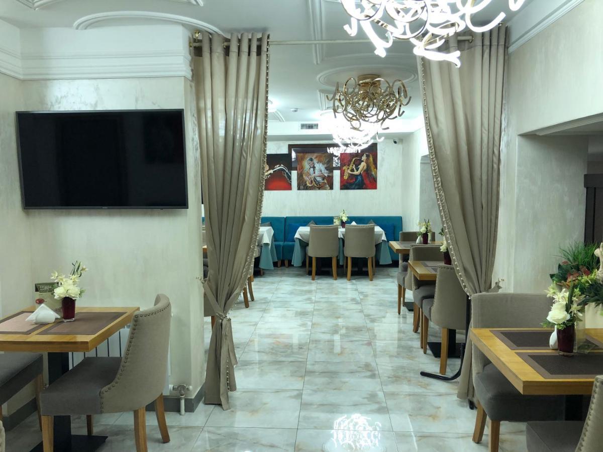 Grace Point Hotel Astana Quarto foto